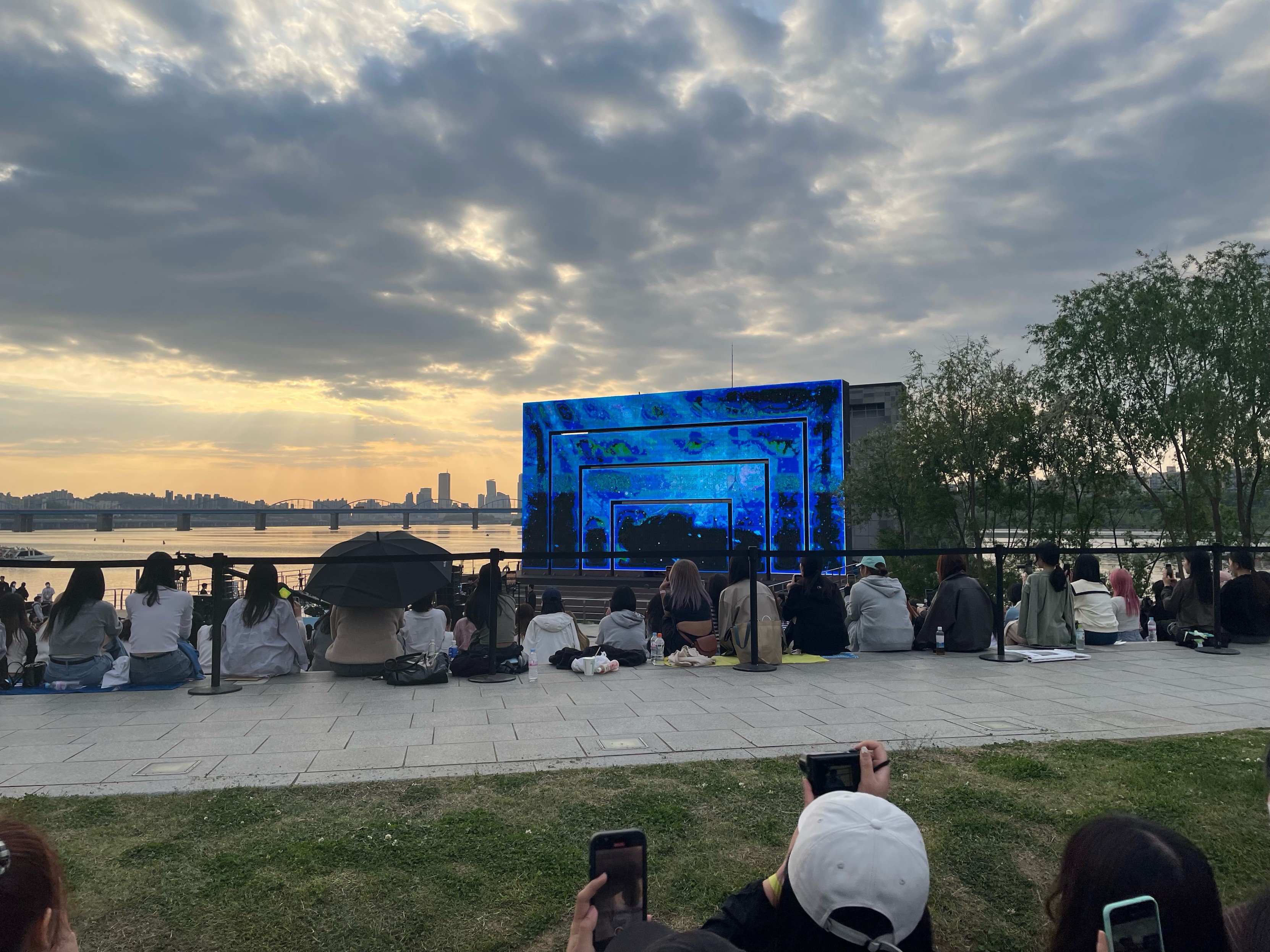 Stage from afar, with a guy on it (supposedly), on the water