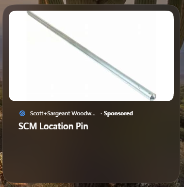 ad for some kind of metal rod or pipe, "SCM Location Pin". I have no idea.